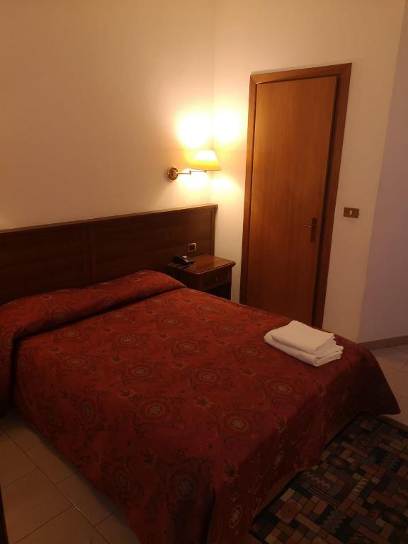 Postel nebo postele na pokoji v ubytování HOTEL BELVEDERE