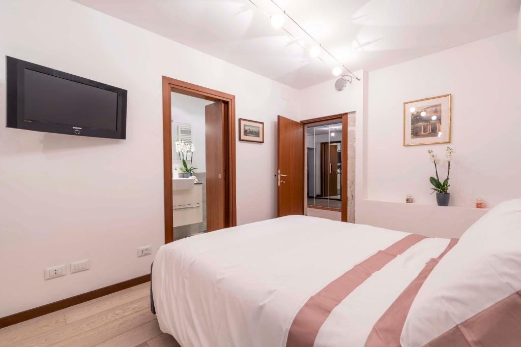 Posteľ alebo postele v izbe v ubytovaní central apt