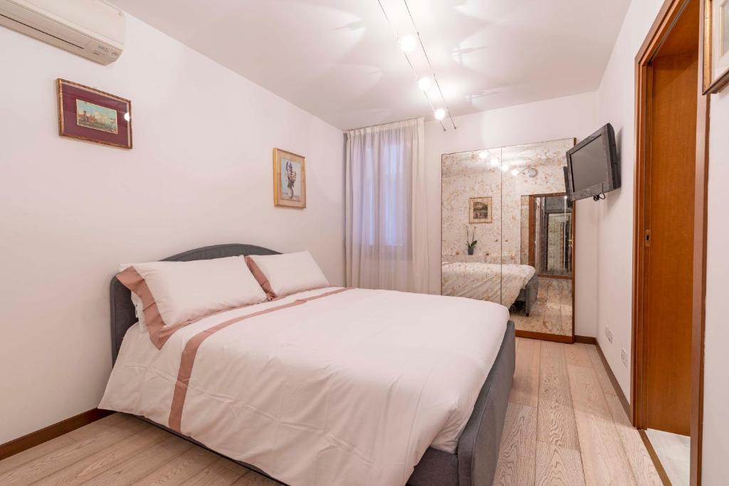 Posteľ alebo postele v izbe v ubytovaní central apt