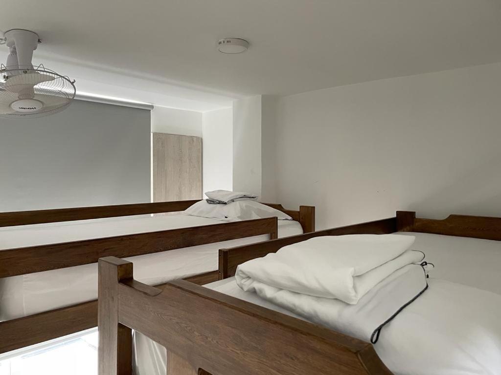 מיטה או מיטות בחדר ב-Casa de Playa frente al mar.