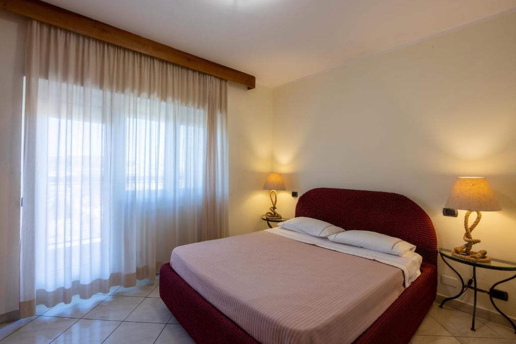Postel nebo postele na pokoji v ubytování Dal Sandro B&B