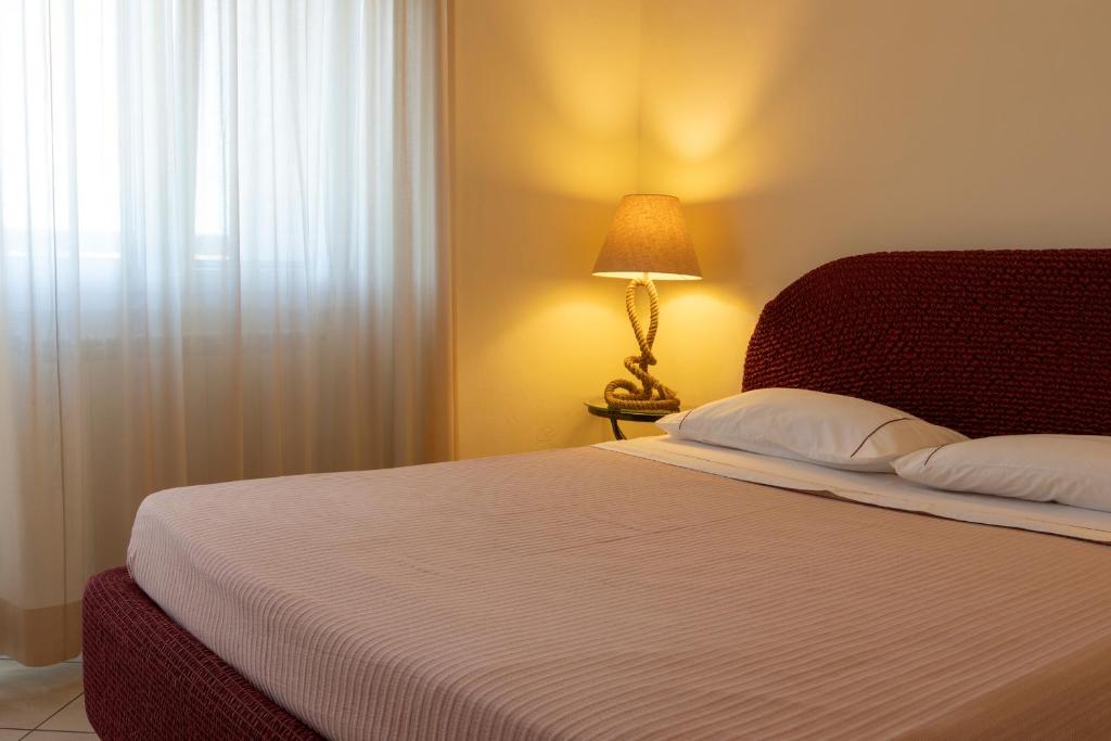 Postel nebo postele na pokoji v ubytování Dal Sandro B&B