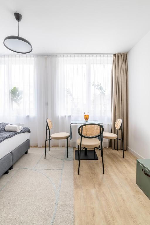 Postel nebo postele na pokoji v ubytování limehome Klagenfurt Karfreitstraße
