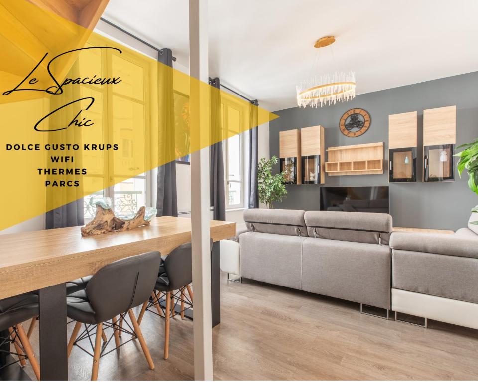 a dining room with a table and chairs at SPACIEUX CHIC - Confort - Proche Parcs & Thermes in Vichy