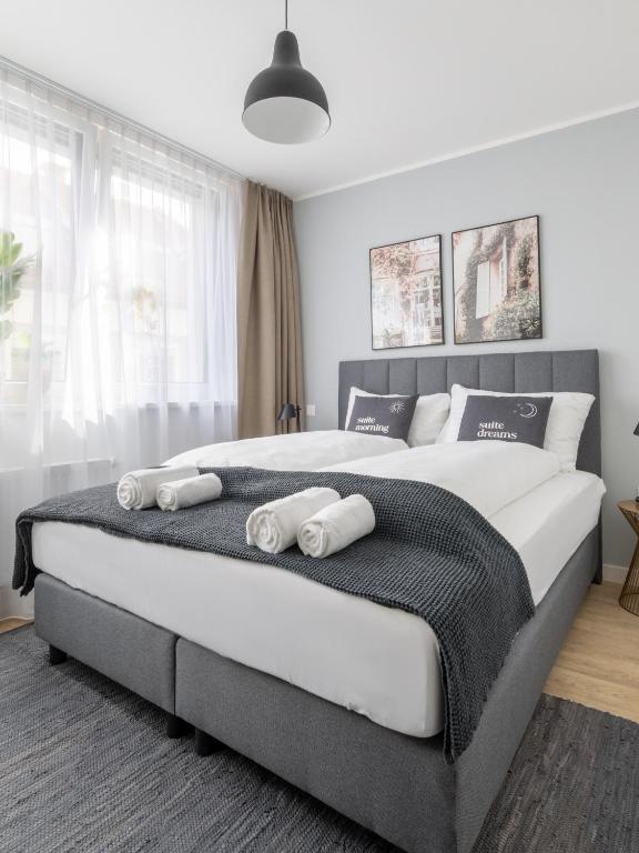 Postel nebo postele na pokoji v ubytování limehome Klagenfurt Karfreitstraße