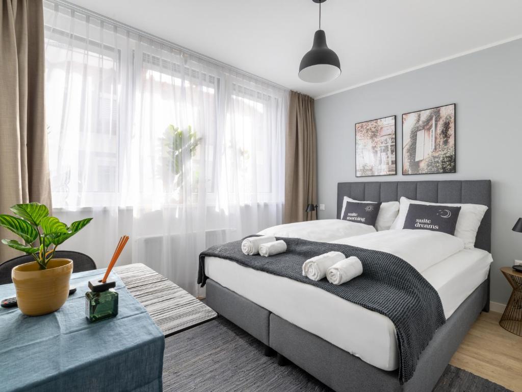 Postel nebo postele na pokoji v ubytování limehome Klagenfurt Karfreitstraße