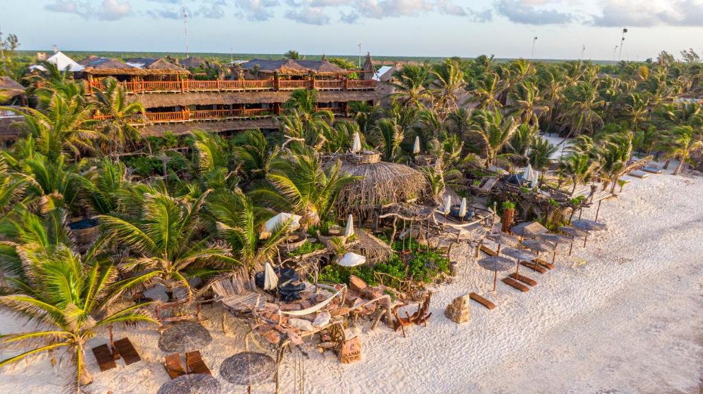 an aerial view of a resort on the beach at Kanan Tulum - Adults Only in Tulum