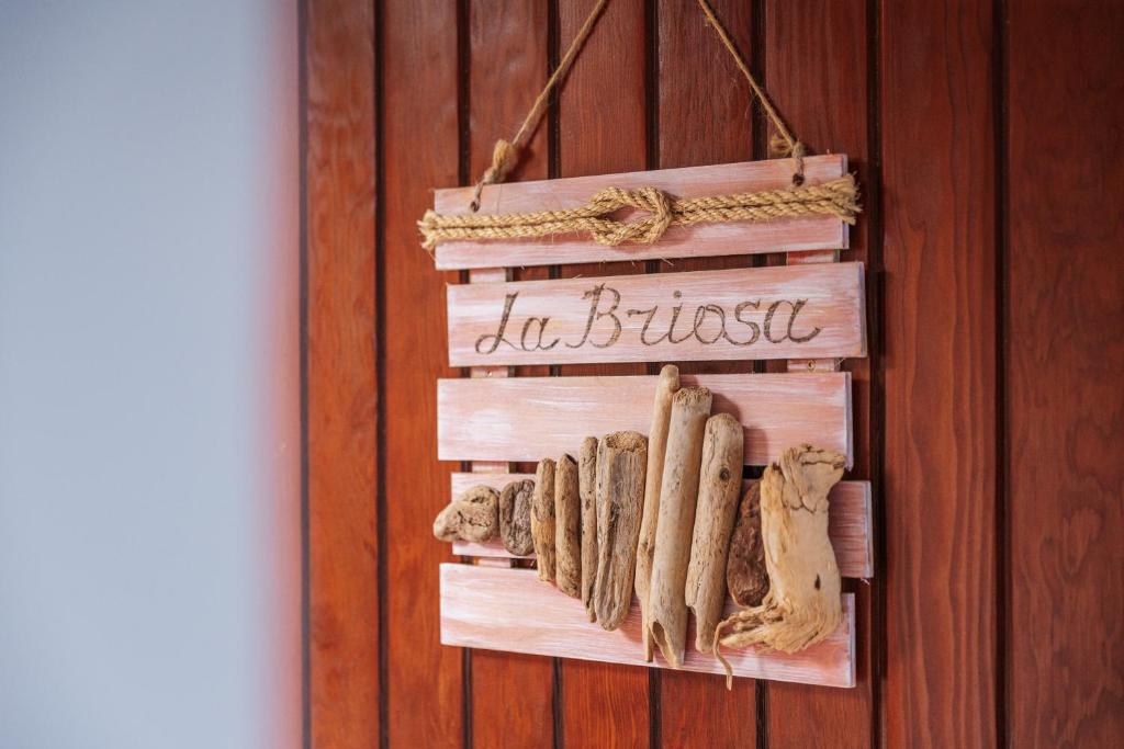 a sign that says in business hanging on a wall at LA BRIOSA-INFINITYHOLIDAYS in Costa Paradiso