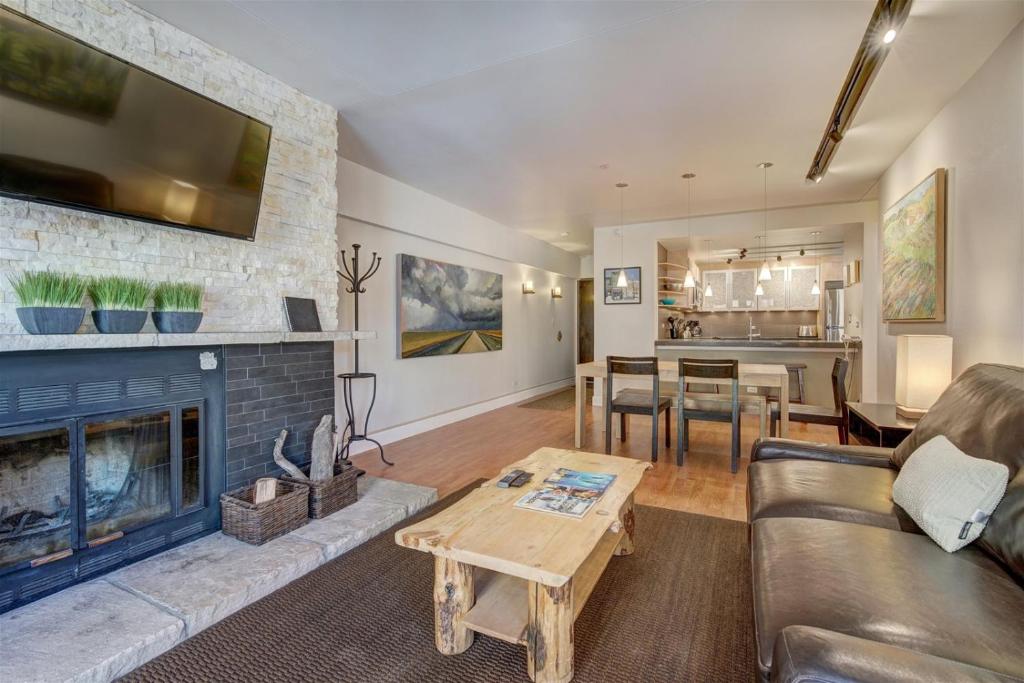 a living room with a couch and a fireplace at Paradise Meadow in Breckenridge