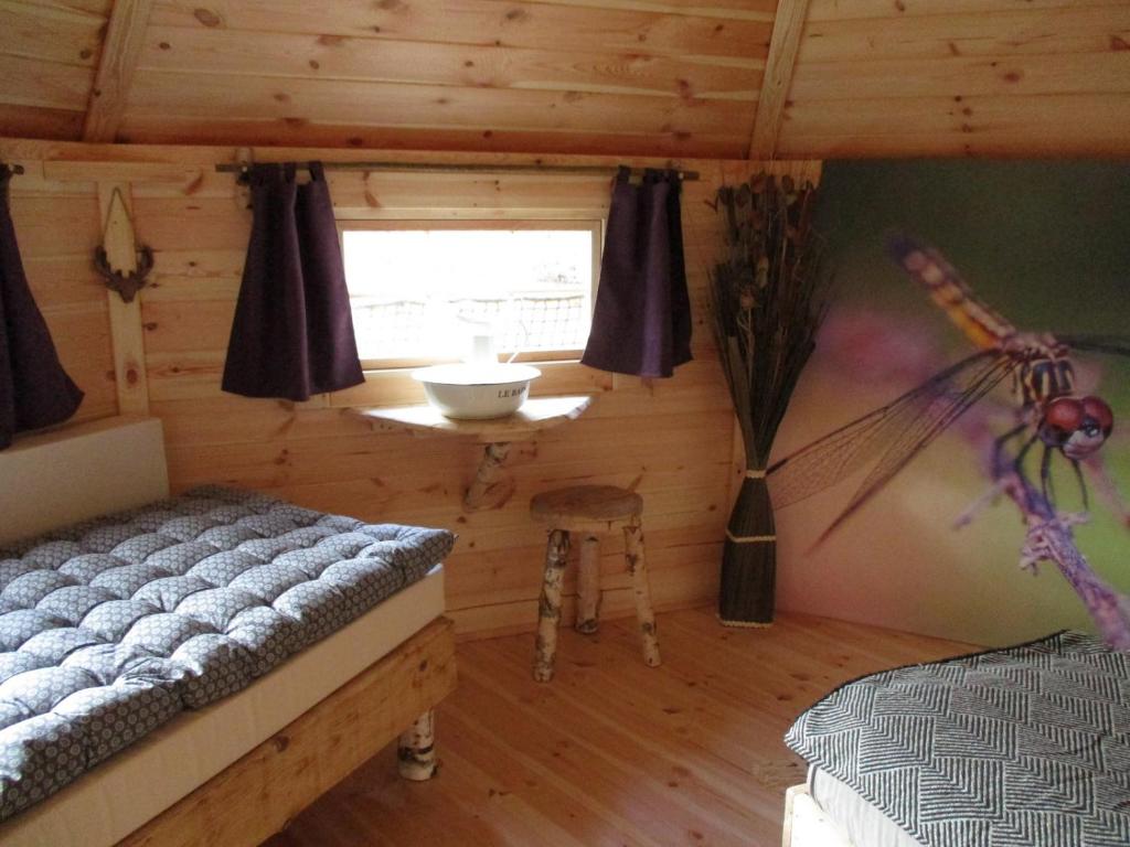Postel nebo postele na pokoji v ubytování Ma cabane en Aveyron