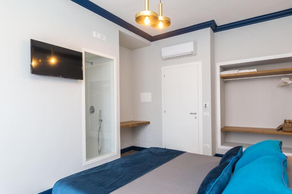 Postel nebo postele na pokoji v ubytování Sorrento Pool&Suites