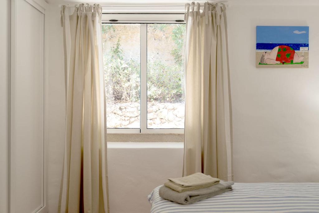 Postel nebo postele na pokoji v ubytování Casa Gaivota-Quinta do Paraíso, Praia Carvoeiro