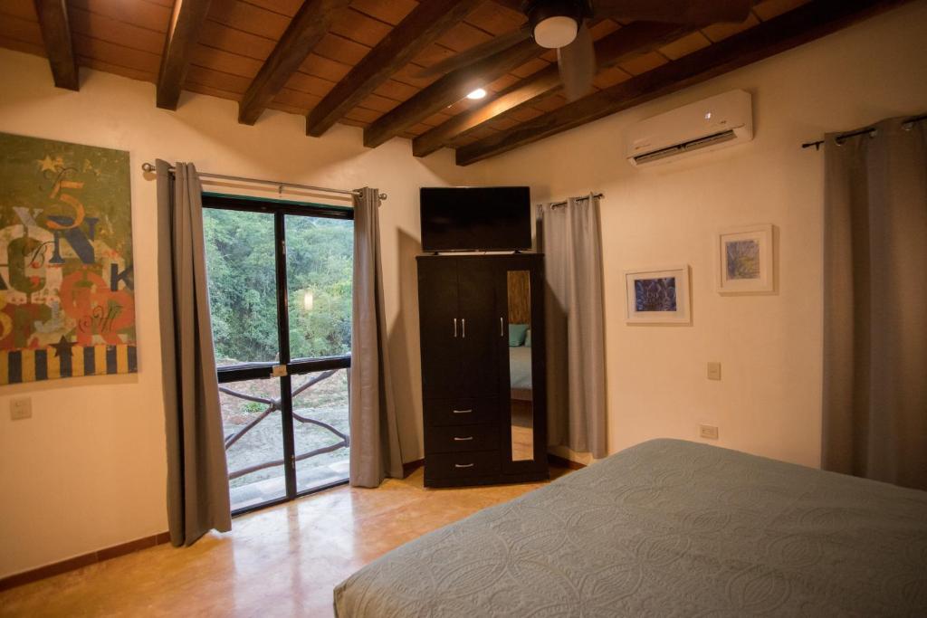 Una cama o camas en una habitación de Amaria Villas