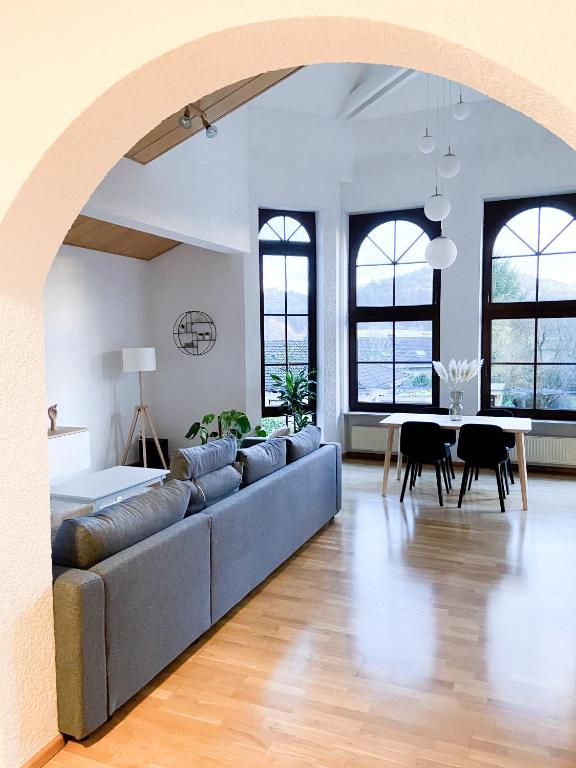 a living room with a couch and a table at Ferienwohnung Burgpanorama in Dahn