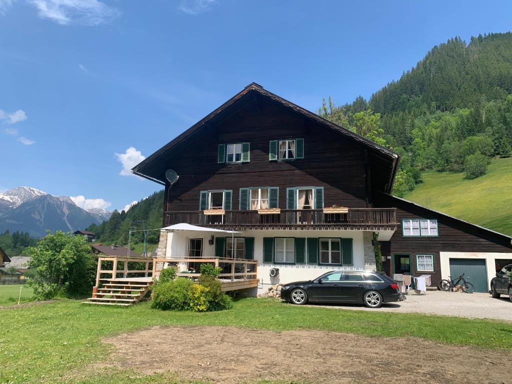 a house with a car parked in front of it at Forest Home Untertal in Schladming