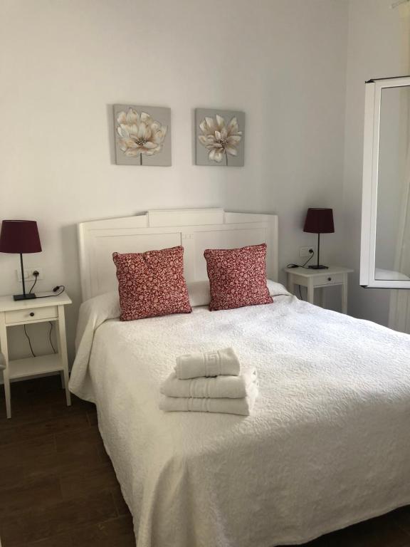 A bed or beds in a room at Casa Atardecer