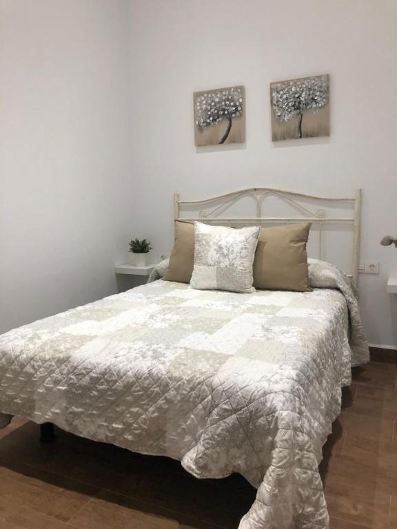 A bed or beds in a room at Casa Atardecer