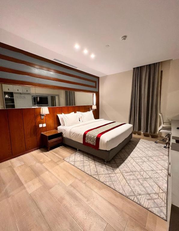 Postel nebo postele na pokoji v ubytování Biz Hotel Apartments