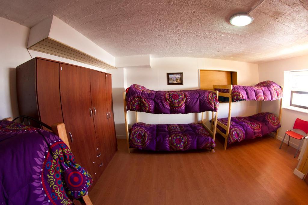 Postel nebo postele na pokoji v ubytování Hostal El Pichon