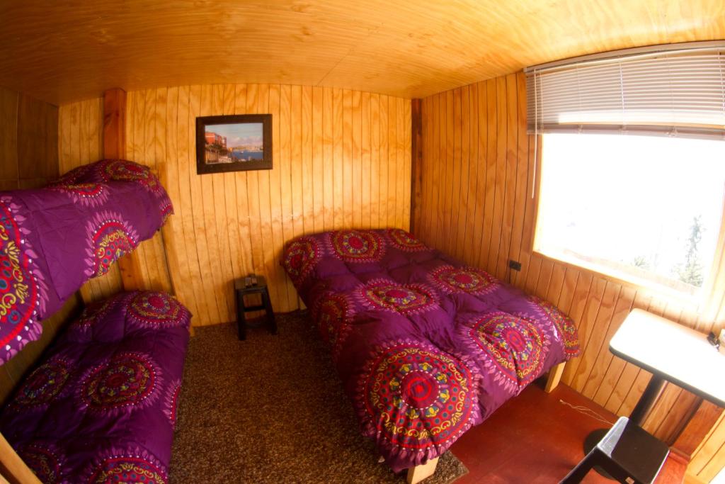 Postel nebo postele na pokoji v ubytování Hostal El Pichon