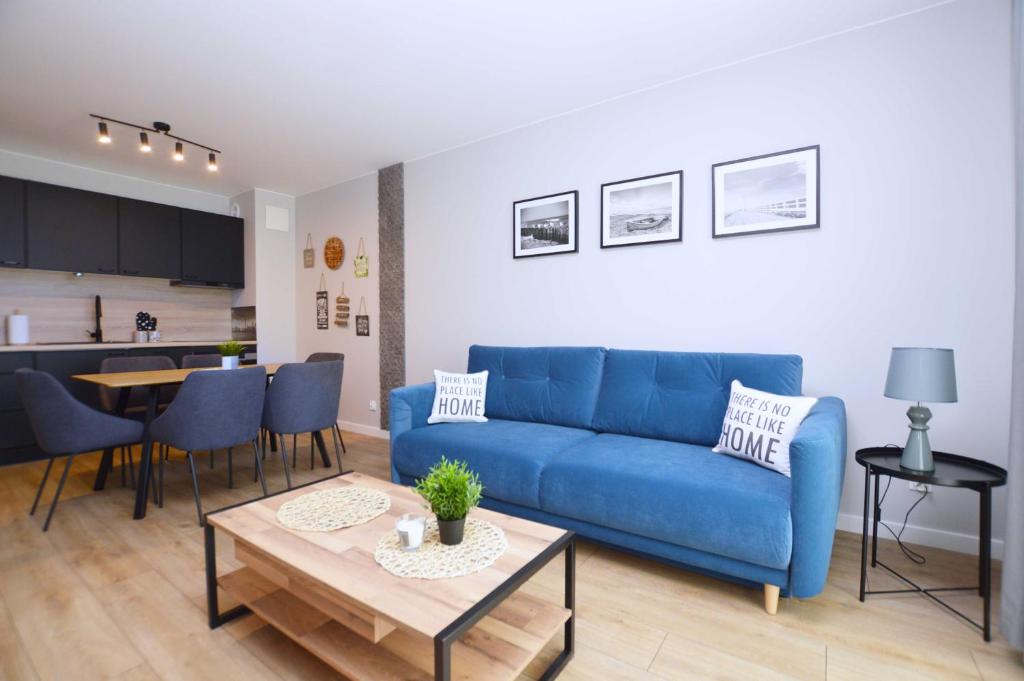 Et opholdsområde på Nowoczesne Apartamenty 3city w Gdańsku z Parkingiem by Noclegi Renters