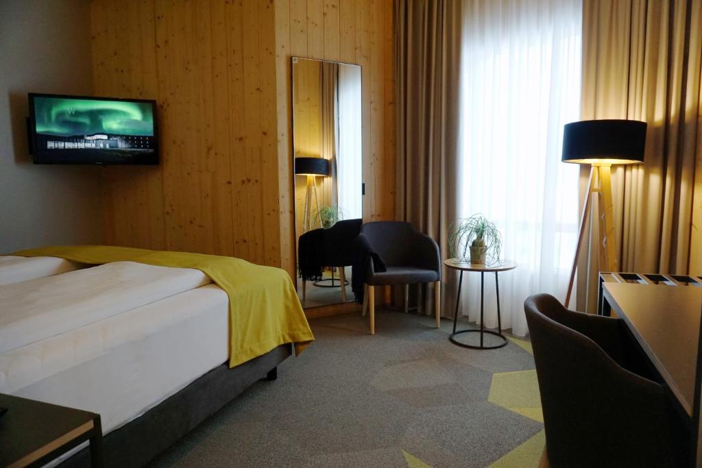 Postel nebo postele na pokoji v ubytování Landhotel