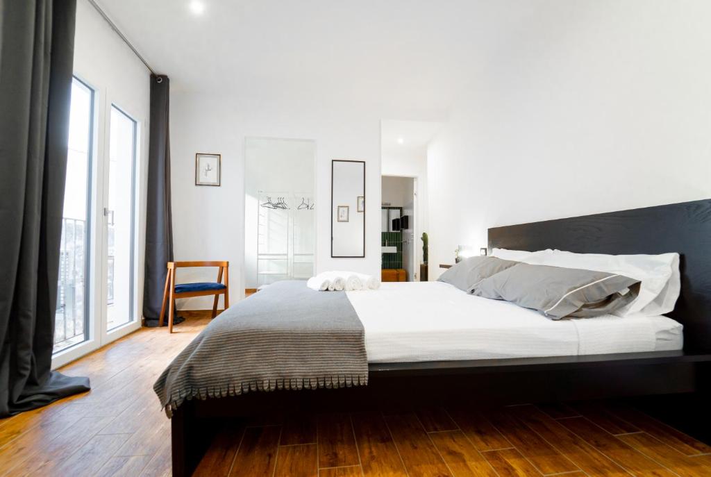 מיטה או מיטות בחדר ב-Civico64 apartments