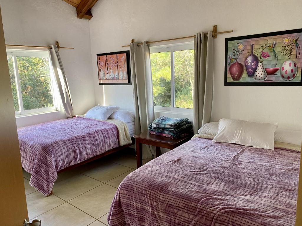Postel nebo postele na pokoji v ubytování Herradura VIP Inn