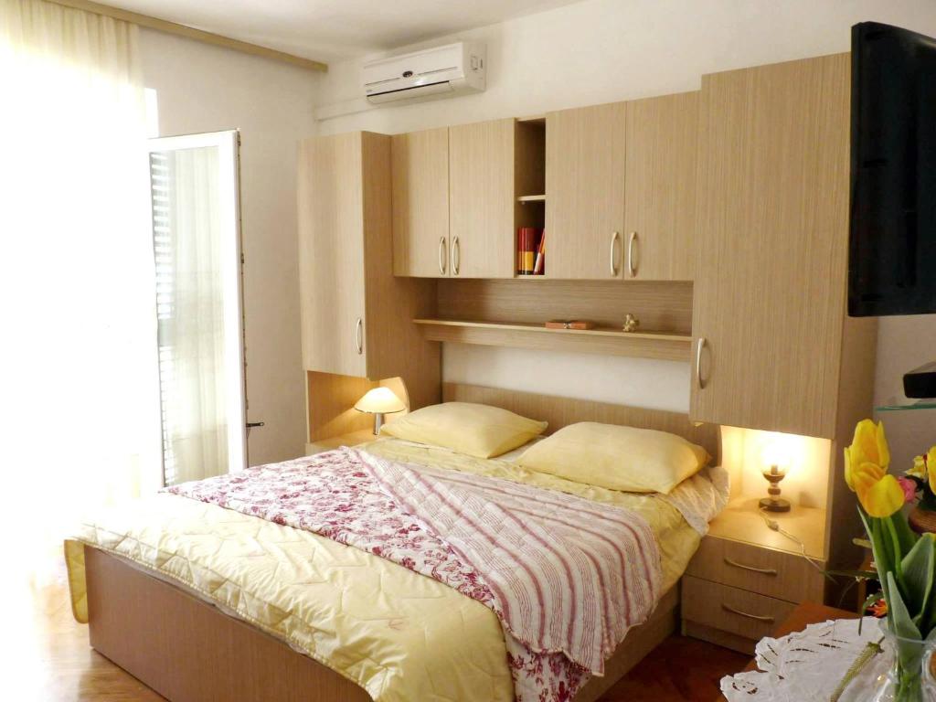Posteľ alebo postele v izbe v ubytovaní Apartments and Room Marin