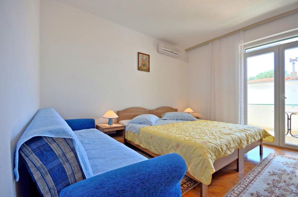 Posteľ alebo postele v izbe v ubytovaní Apartments and Room Marin