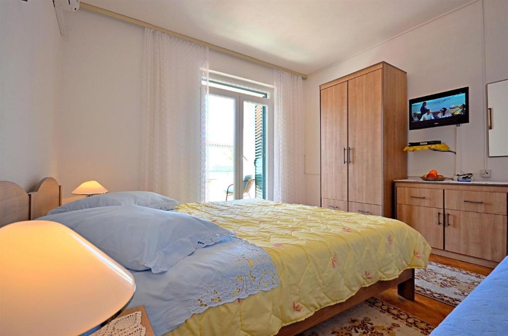 Posteľ alebo postele v izbe v ubytovaní Apartments and Room Marin