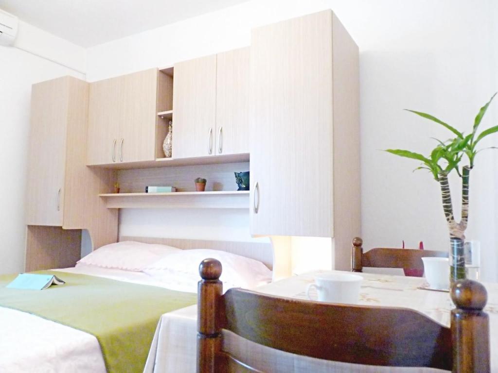 Posteľ alebo postele v izbe v ubytovaní Apartments and Room Marin