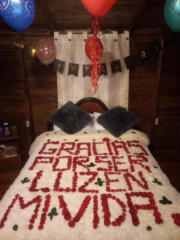 Postel nebo postele na pokoji v ubytování Cabaña Sueños Dorados