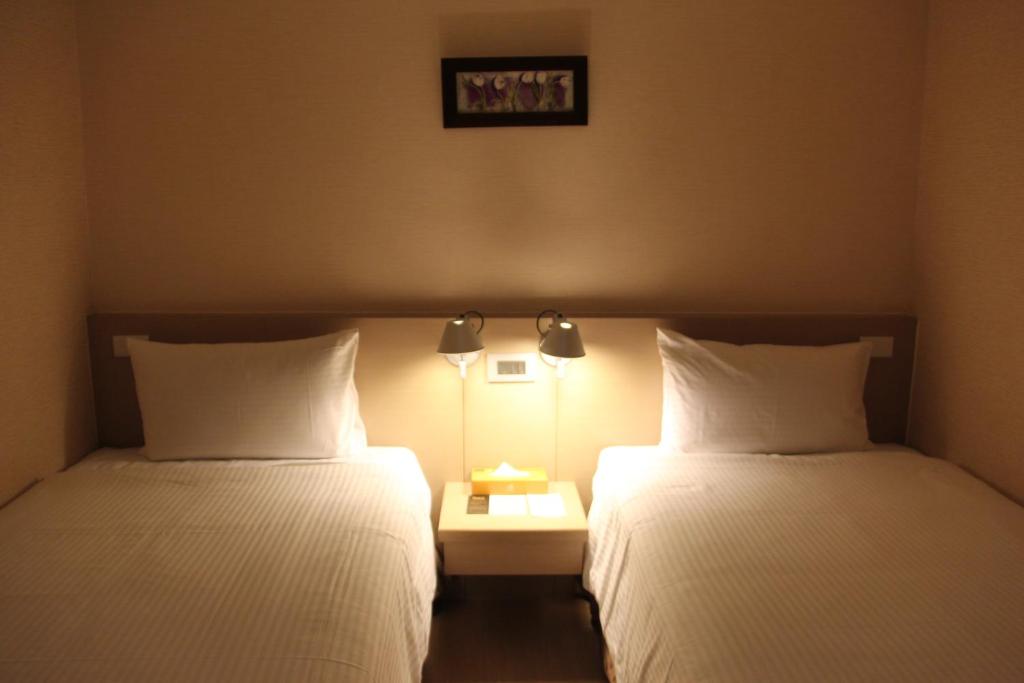 Postel nebo postele na pokoji v ubytování Mellow Fields Hotel