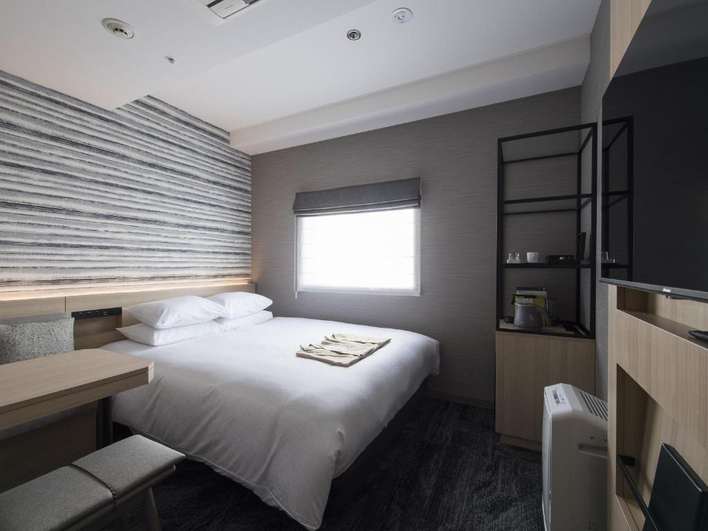 Postel nebo postele na pokoji v ubytování Tmark City Hotel Kanazawa