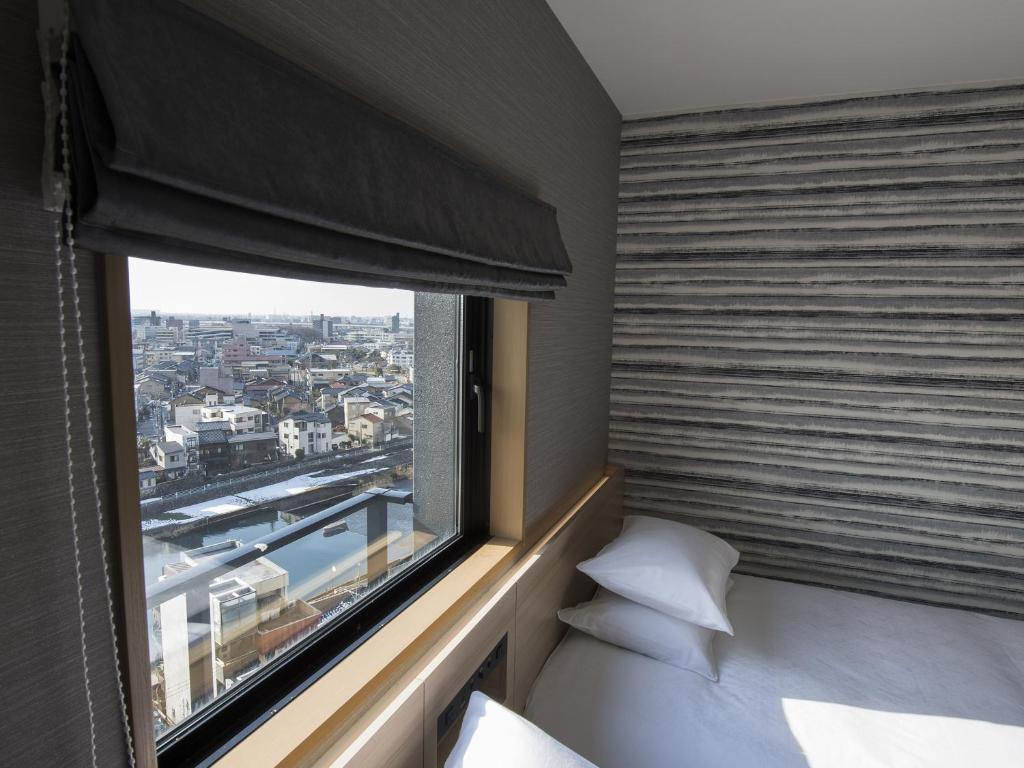 Postel nebo postele na pokoji v ubytování Tmark City Hotel Kanazawa