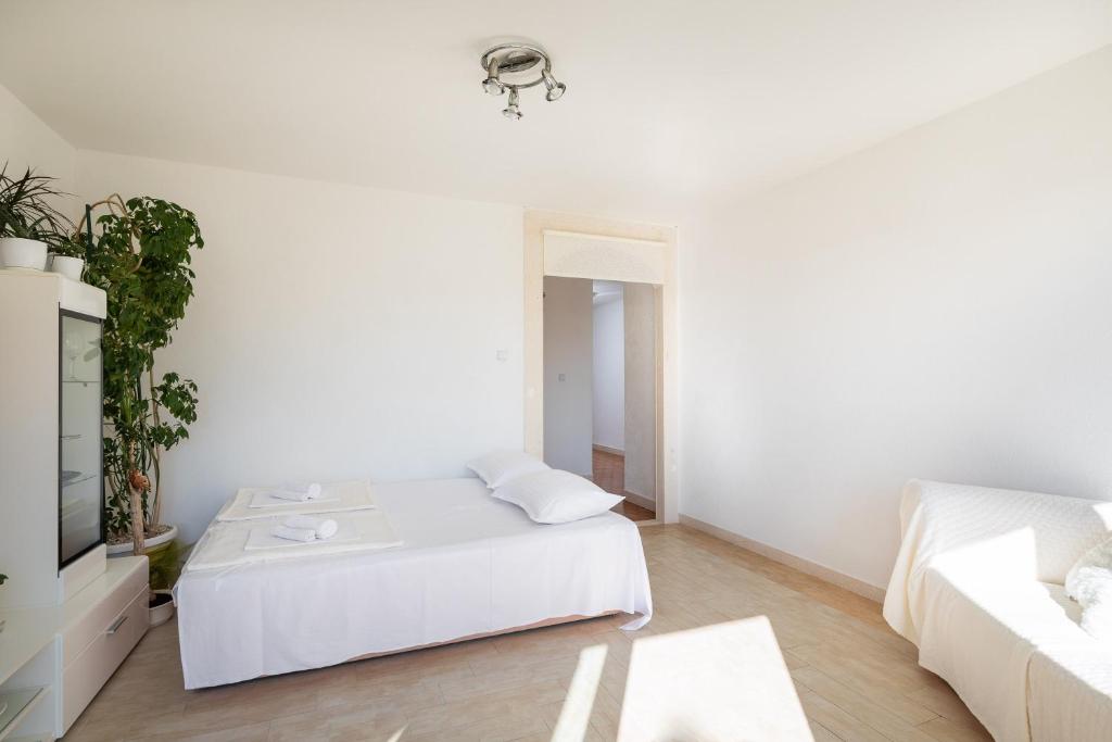 Posteľ alebo postele v izbe v ubytovaní Adriatic Apartment