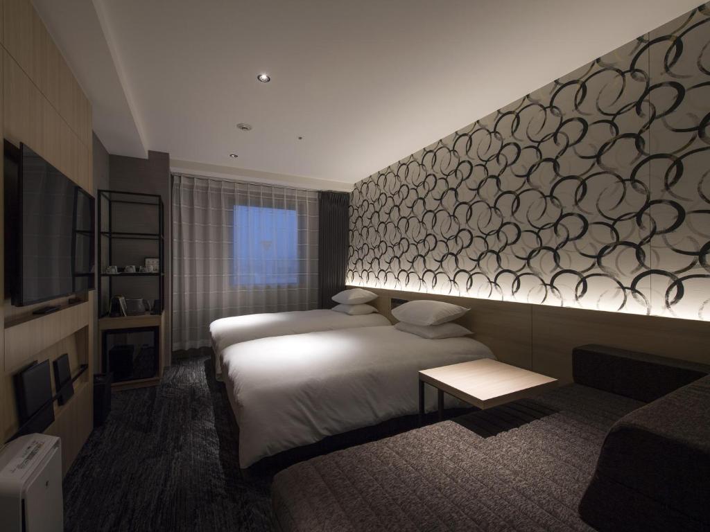Postel nebo postele na pokoji v ubytování Tmark City Hotel Kanazawa