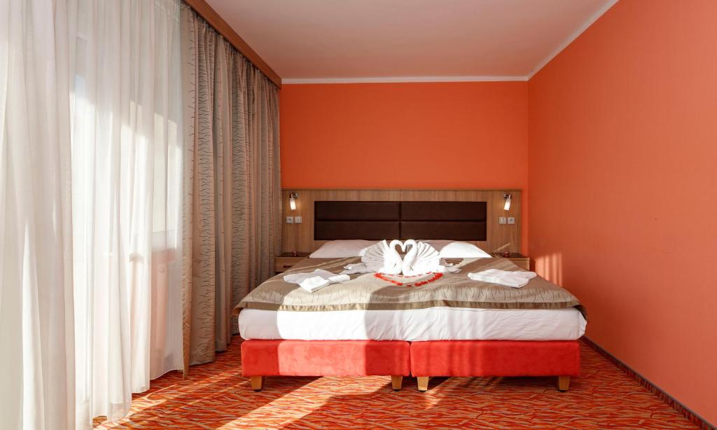Postel nebo postele na pokoji v ubytování Hotel Opera
