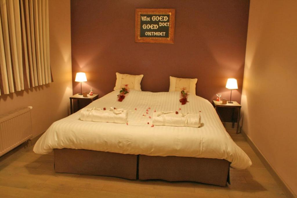 Postel nebo postele na pokoji v ubytování B&B De Pethaan