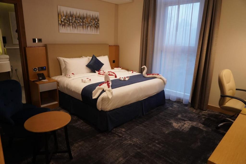 Postel nebo postele na pokoji v ubytování AL HAYAT HOTEL