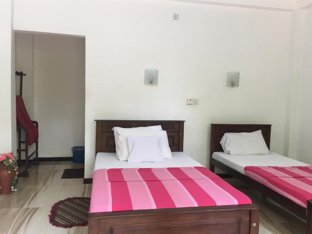 Postel nebo postele na pokoji v ubytování Anthony Guesthouse