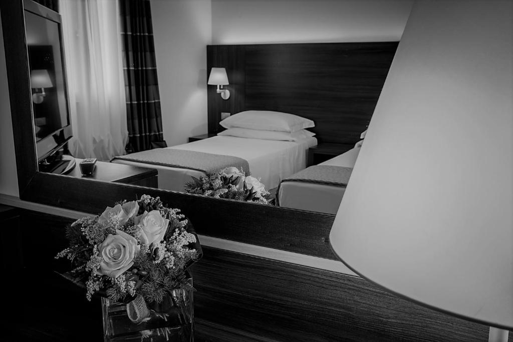 Postel nebo postele na pokoji v ubytování Delfina Palace Hotel