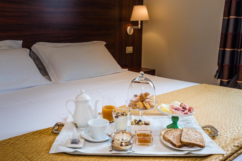 Postel nebo postele na pokoji v ubytování Delfina Palace Hotel