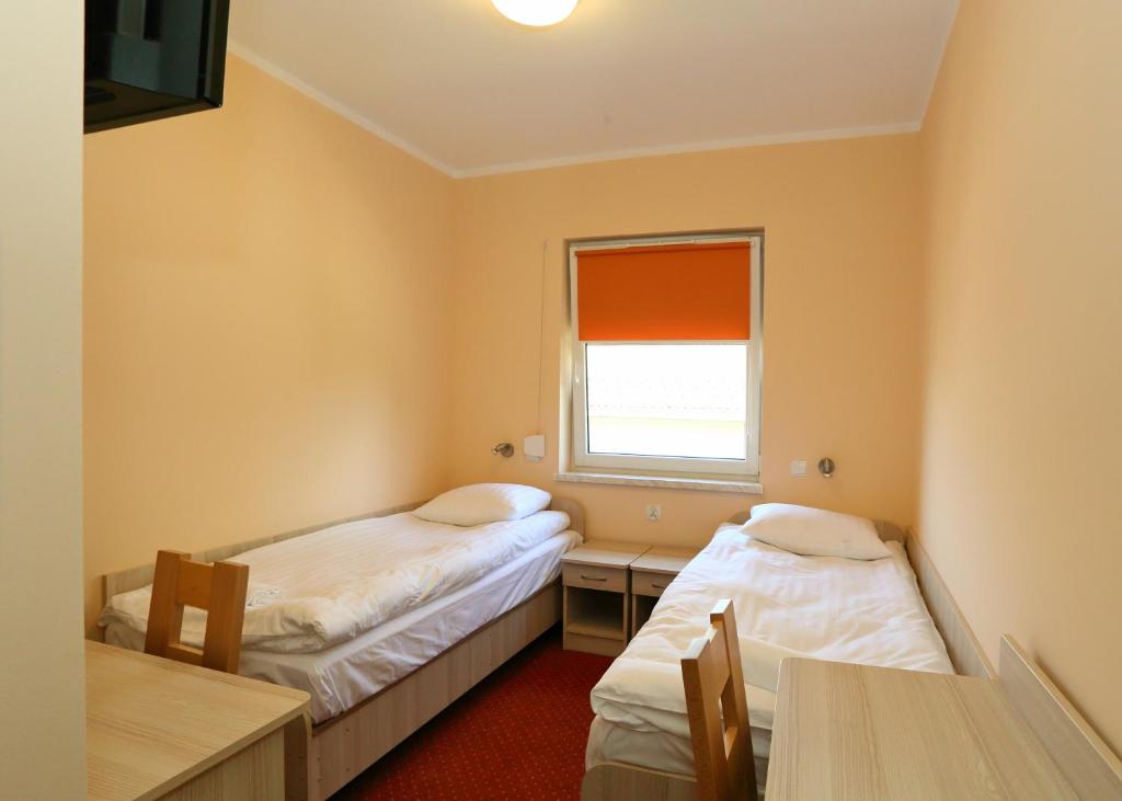 Postel nebo postele na pokoji v ubytování Hostel Żywiec