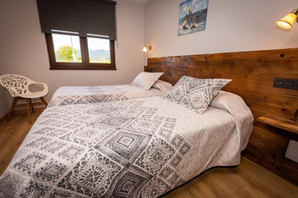 Łóżko lub łóżka w pokoju w obiekcie Apartamentos Casa Carin