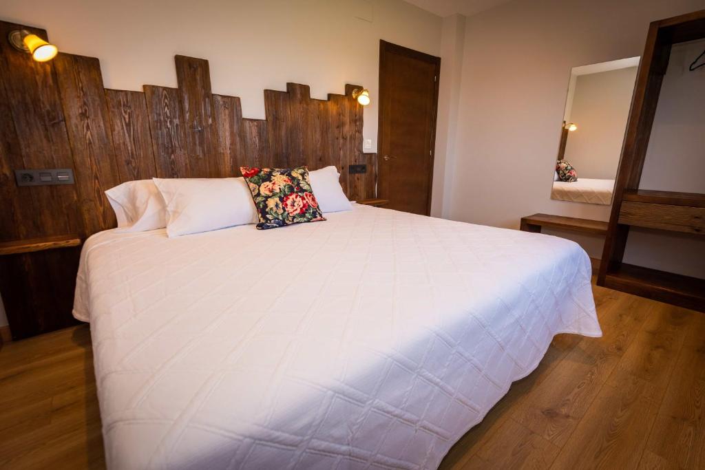 Łóżko lub łóżka w pokoju w obiekcie Apartamentos Casa Carin