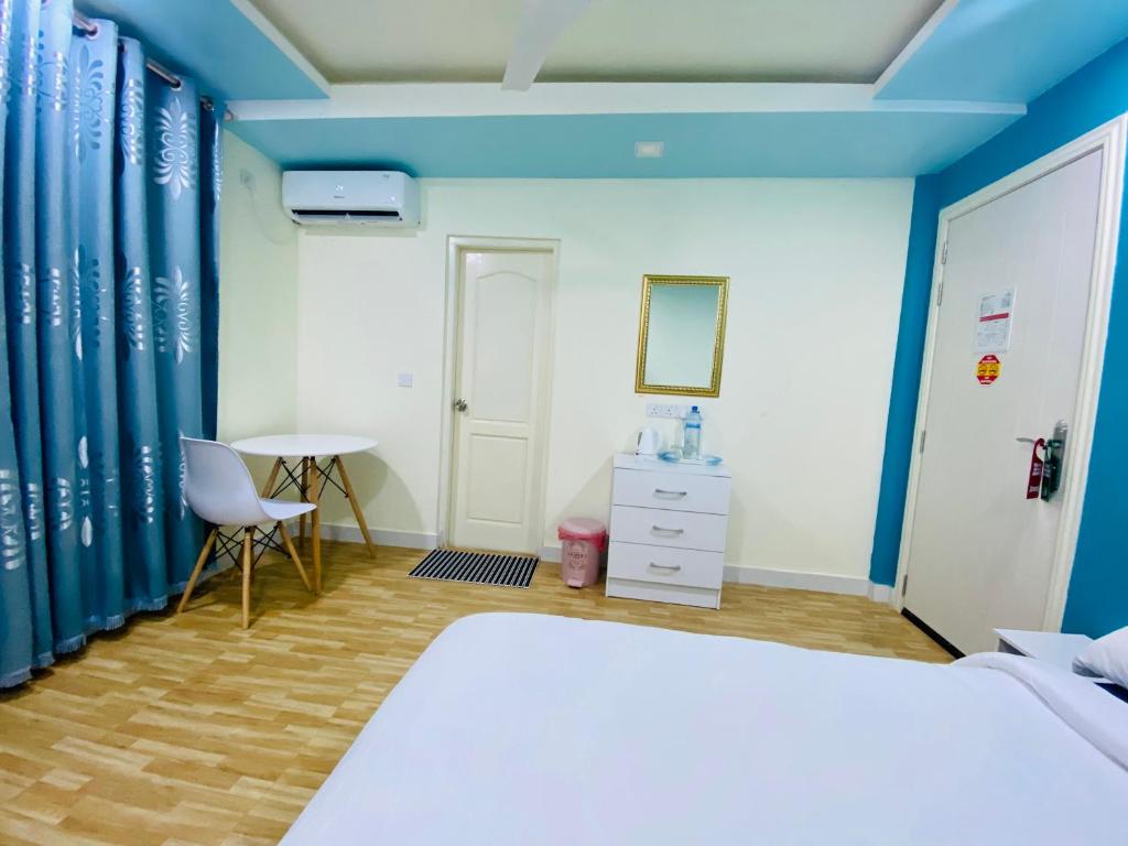 Postel nebo postele na pokoji v ubytování Hedheykuri Residence Fuvahmulah
