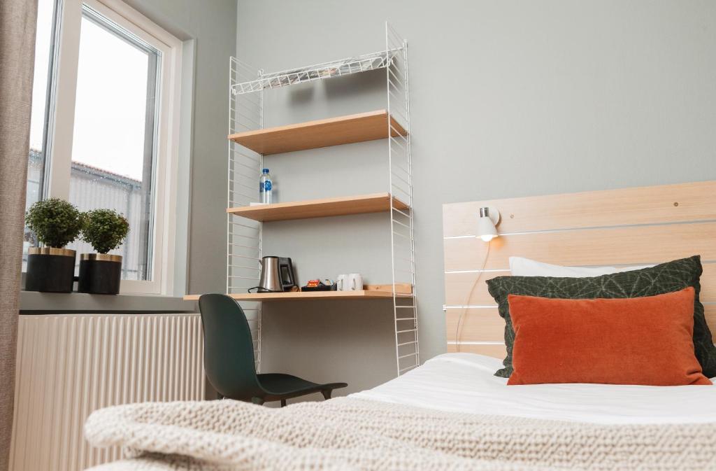 Postel nebo postele na pokoji v ubytování Hotell Lassalyckan