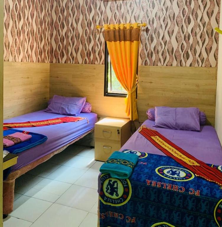 Letto o letti in una camera di Nuwono Tasya Syariah